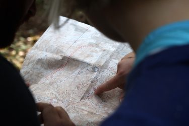 If you are the leader of a hiking or camping group, take the time to spread a map out on the ground.