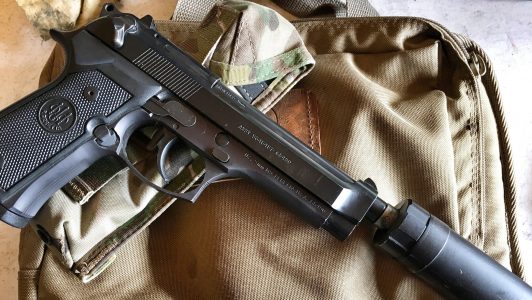 M9 Beretta pistol with Silencerco threaded barrel and AAC Silencer